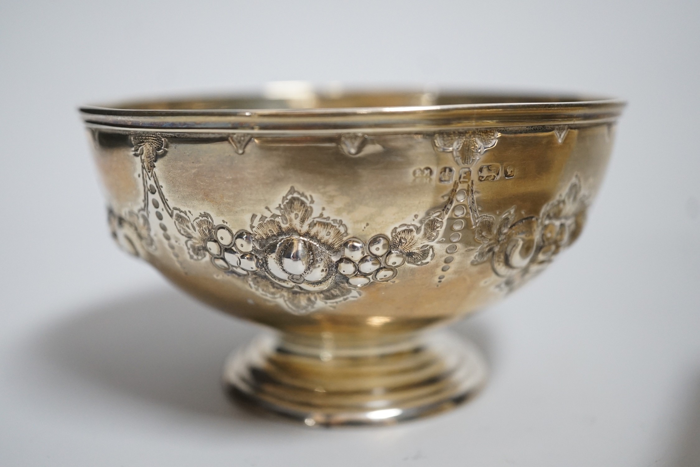 A George V silver milk jug and sugar bowl, London, 1917, a silver mounted cigarette box and a small silver bowl.